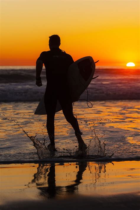 Surfer In The Surf At Sunset At Oceanside January 17 2015 Sunset