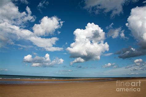 Cumulus Cloud Passing Across The Beach At Holkham Norfolk England