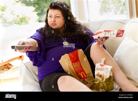 Woman Eating Fatty Food Stock Photo Alamy