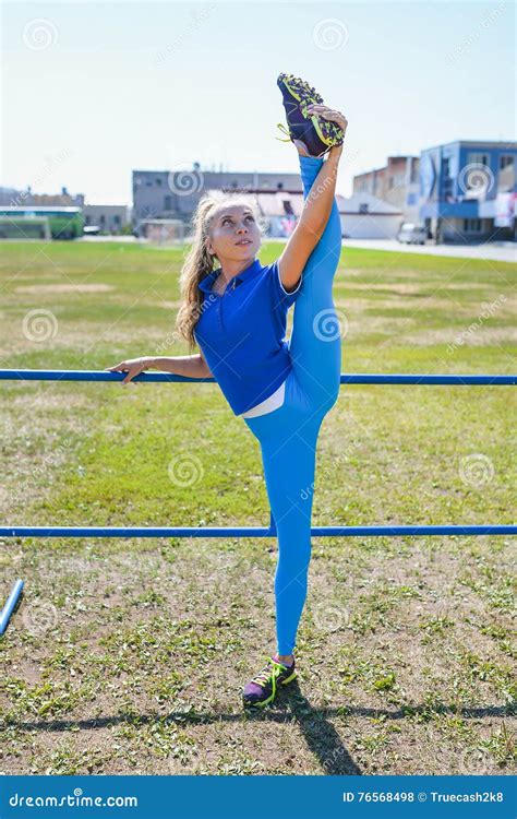 Slim Beautiful Woman Training And Doing Standing Splits Outdoor Stock Photo Image Of