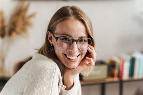 Photo Of Smiling Attractive Woman In Eyeglasses Looking At Camera Stock