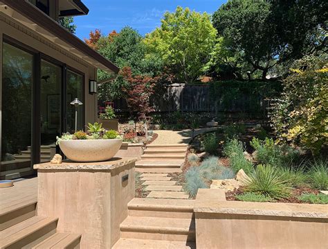 Serene Landscape Under Oak Trees With Travertine Stone Patios And
