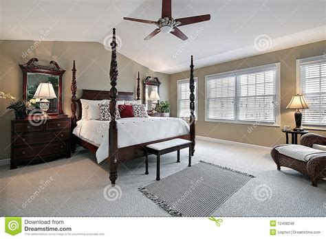Contemporary design ideas with alluring animal rug. Master Bedroom With Dark Wood Furniture Royalty Free Stock ...
