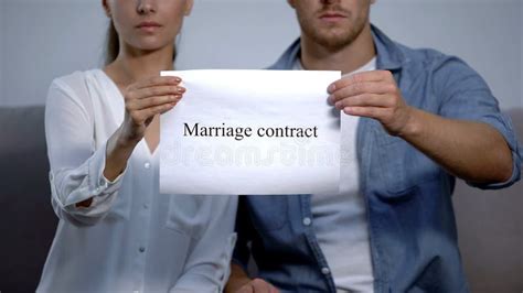 Sad Couple Holding Marriage Contract Phrase On Cardboard Divorce Problem Stock Image Image Of