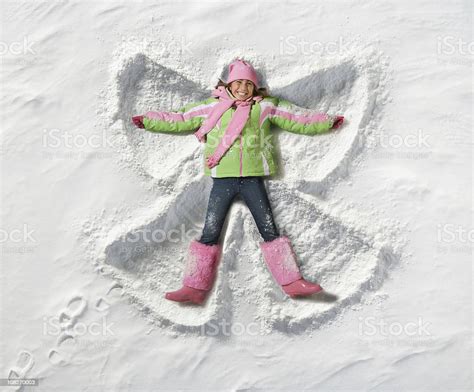 Young Girl Making A Snow Angel Stock Photo 108270003 Istock