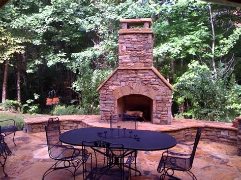 Outdoor Stacked Stone Fireplace With Hearth And Seating Walls Outdoor
