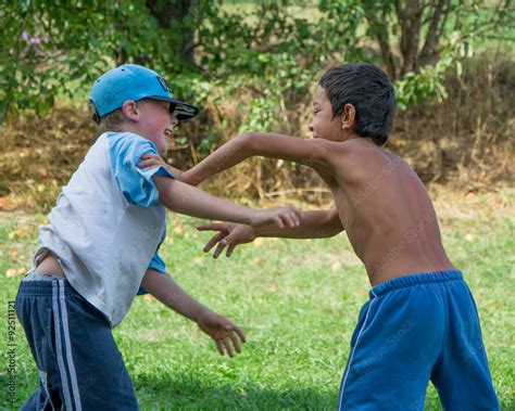 Boys Different Race Fight Against Each Other Stock Photo Adobe Stock