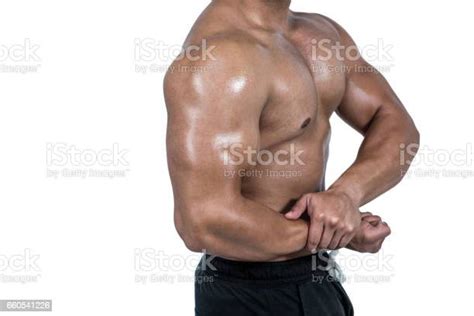 Muscular Man Flexing His Biceps Stock Photo Download Image Now 20