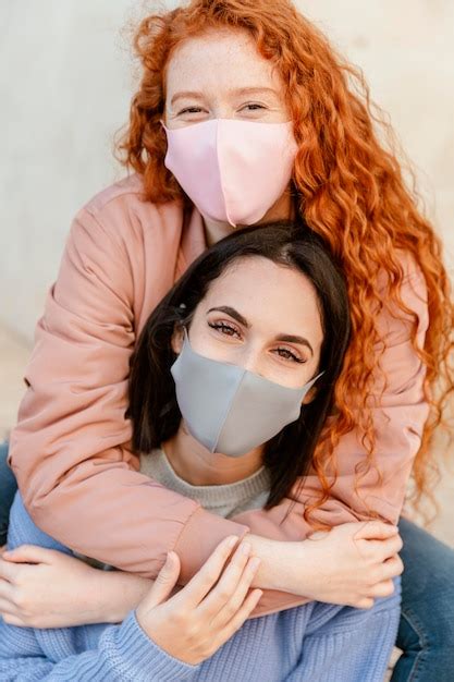 Free Photo Front View Of Smiley Female Friends With Face Masks Outdoors