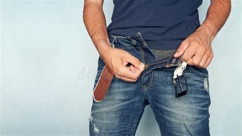 Close Up Of A Man S Hand Unzipping The Blue Jeans Stock Photo Image Of Closeup Body