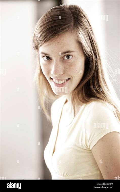 Teenage Girl Woman 17 Years Old Wearing A Light Top Stock Photo Alamy