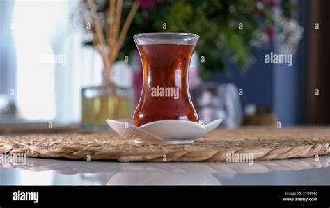 Turkish Tulip Glass Filled With Hot Steaming Tea On The Table Inside A