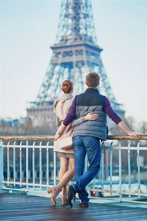 Romantic Couple Near The Eiffel Tower In Paris France Stock Photo