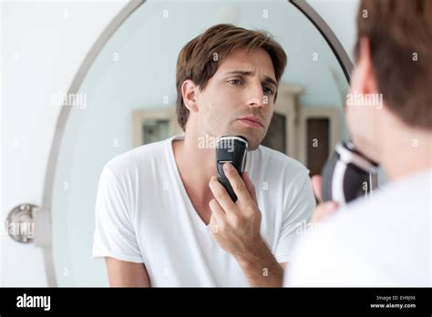 Man Shaving With Electric Razor Stock Photo Alamy