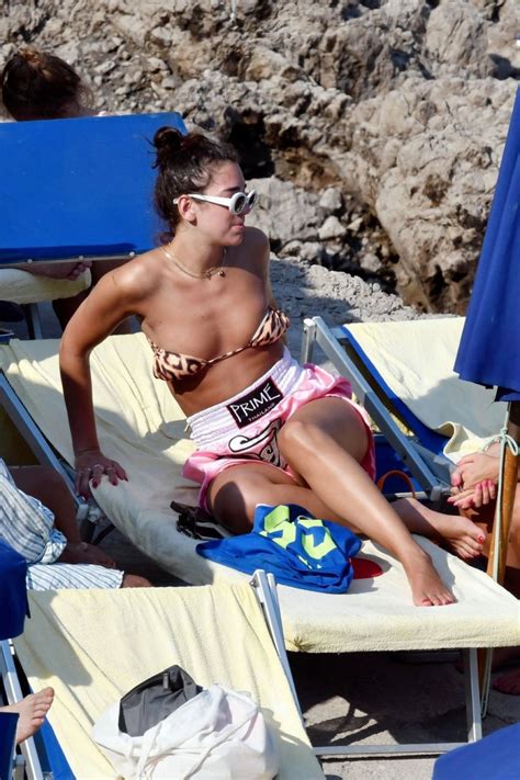 Dua Lipa In Bikini Top Sunbathing On Summer Holiday In Capri