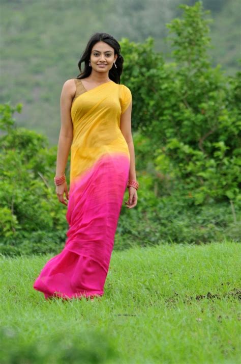 Tollywood Actress Nikitha Narayan Hip Navel Show Stills In Yellow Saree Noshwind