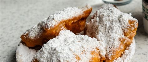 Fresh Beignets Come Out Of The Fryer Topped With Powdered Sugar No