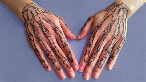 20 Terrifying And Cool Skeleton Hand Tattoos