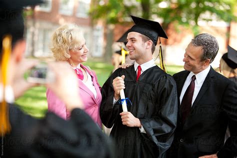 Graduation Parents Proud Of Son Graduating From School By Stocksy