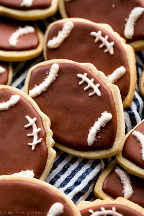 Decorating cookies — whether made of gingerbread, sugar cookie or anything else — with icing and candy is a classic for a reason… it's fun! How to Make Football Cookies | Sally's Baking Addiction