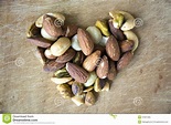 Love nuts on wooden stock image. Image of nuts, seed - 37637465
