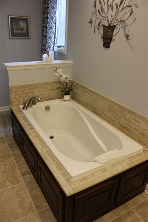 Beautiful Soaking Tub With Tile Surround And Cabinet Base Bathrooms