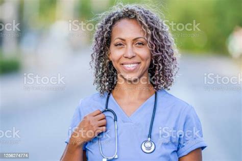 African American Nurse Standing Outside Stock Photo Download Image