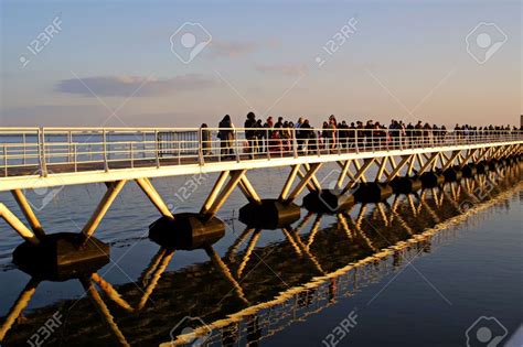 People Crossing Bridge Water Reflections Stock Photos Photo