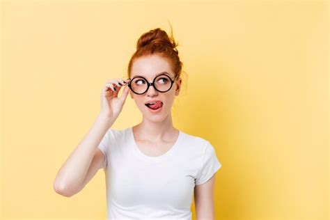 free photo tempting ginger woman in eyeglasses licking her lips