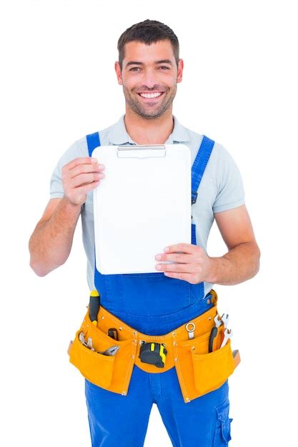 Premium Photo Portrait Of Happy Repairman Showing Blank Clipboard