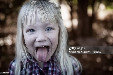 Young Girl Sticking Tongue Out High Res Stock Photo Getty Images