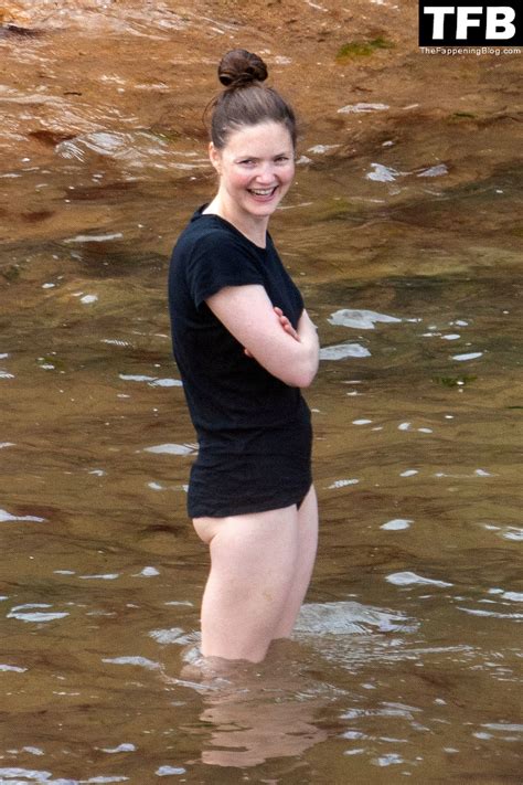 Holliday Grainger Takes A Dip In The Water During A Trip To The Beach