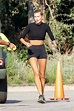 hailey bieber looks fit in a black crop top and shorts after finishing ...