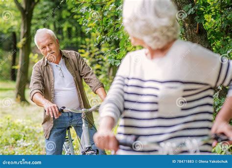 Senior Man And Woman Riding Bikes In Forest Stock Image Image Of
