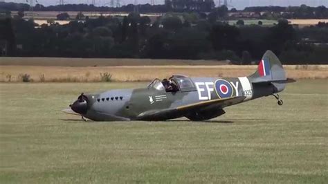 dramatic moment a replica spitfire lands without undercarriage youtube
