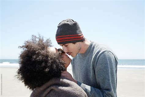 Couple Being Romantic And Kissing At The Beach By Stocksy Contributor Trinette Reed Stocksy