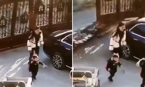 Chinese Mother And Son Almost Crushed By A Huge Iron Gate