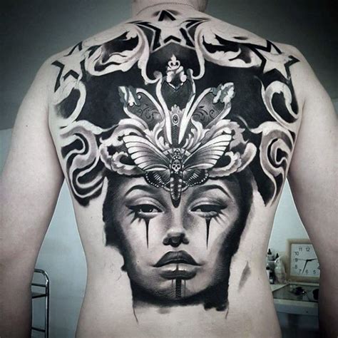 Blackwork Style Impressive Looking Back Tattoo Of Woman Face With Big