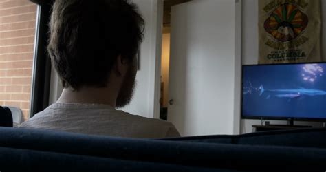 Over the Shoulder Shot of Man Watching TV Stock Video Footage - Storyblocks