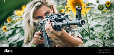 Beautiful And Attractive Woman Soldier With Rifle Machine Gun Front