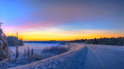 Panorama of the setting sun with a set of clouds. Wallpaper HDRI Nature Winter Snow Roads Sunrises and sunsets