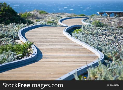 Winding Wooden Walkway Leading Towards The Ocean Free Stock Images