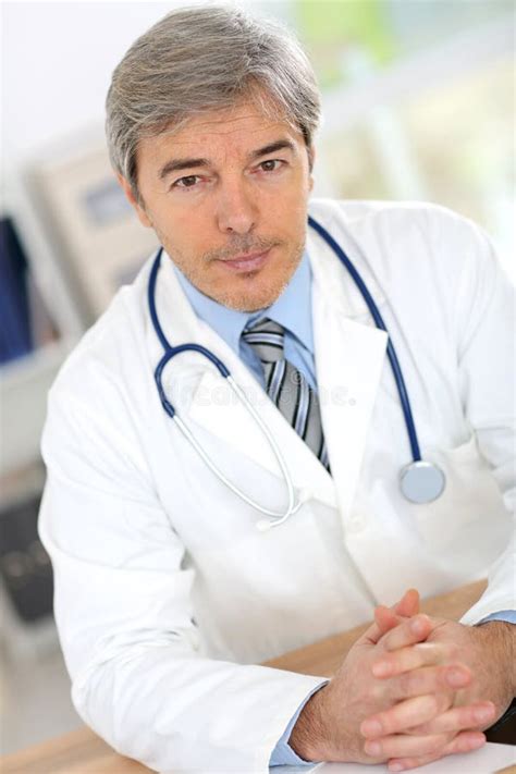 Handsome Doctor At Medical Office Stock Photo Image Of Camera Smile