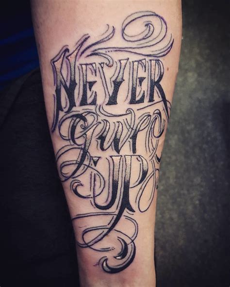 This never give up tattoo with a paper plane is playful, as well as simple to get. Never give up tattoo by Sean at www.adventuretattoos.com ...