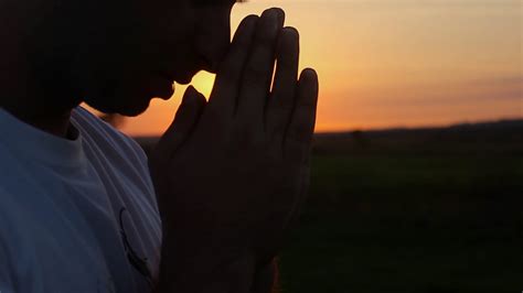 Silhouette Of A Man Praying At Sunset Concept Of Religion Silhouette