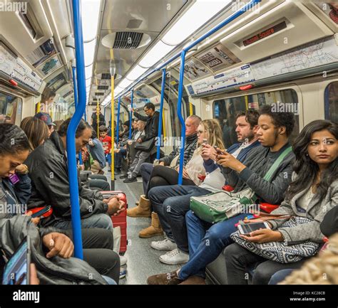 London Underground Tube Train Passengers Commuters Sitting Inside A