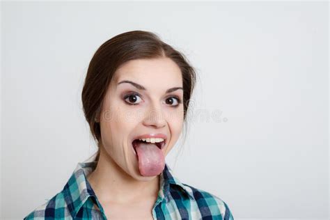 Young Woman Showing Her Tongue Stock Image Image Of Indoors
