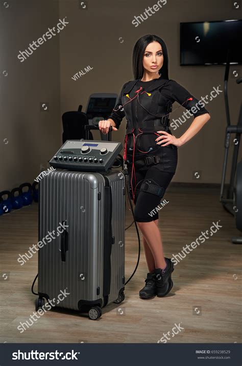 Beautiful Brunette Girl Electrical Muscular Stimulation Stock Photo