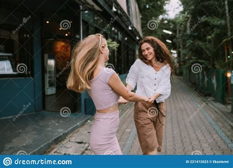 Two Lesbians Having Fun On The Street Stock Image Image Of Whirl Cafe 221412023
