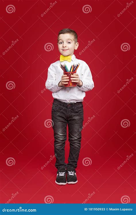 Schoolboy Carrying Cup With Colored Pencils Stock Image Image Of